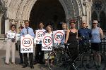 Cyclists and road safety campaigners stand outside the High Court