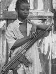 an African child soldier wearing a H&K G3 rifle