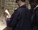 Two City of London policemen reading the Financial Crimes on Friday 22 (picture)
