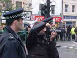 Pic: Police cameraman photographing demonstrators