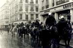 Line of police officers on horses