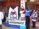 Activists at Greenpeace stand