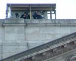 One of several teams US? snipers atop the palace check out the growing crowd bel
