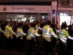 heavy cordon escorts protestors along oxford street