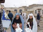 Two women, posters, registration cards