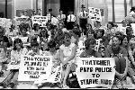 Women and children demonstrating against £15 being deducted from striking miners