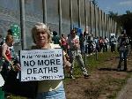 Scottish National Party MSP Sandra White with a placard.