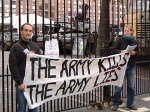 Main gate, a banner and the tanks