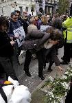 Anti war protesters lay flowers at cenotaph.