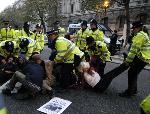 Anti war protesters are moved off road by police