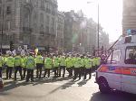 Line at Piccadilly Circus 1 (police, barriers, vans)