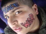 Young Kasim, aged 13, shows off his anti-'war paint' on the coach