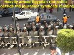 Egyptian riot police outside main building.