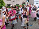 Residents come out of their houses to hear the samba