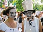 Sad clown faces, all dressed in white