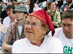 Older woman listens to speakers at the Stop the War Coalition / CND stage
