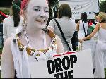 White faced protester calling on G8 leaders to 'Drop the Debt'