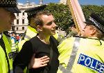 Man is separated from his banner and arrested