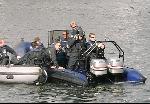 Defence Police + Surveillance Cameraman In Boats