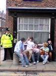 Pub buskers entertain police & protestors