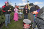 Band prepare to play. Colnbrook Detention Centre in background