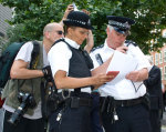 Police check the legality of the march.