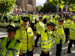 apt symbol behind a sea of cops