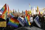 Italian ARCIGAY gay rights association activists hold banners and flags in Rome