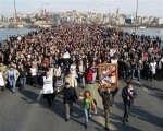 Thousands of people march on the Unkapani bridge over the Golden Horn