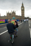 Greenpeace cyclists come over Westminster Bridge