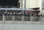 nibbles and drinks on deck of British warship moored outside arms fair