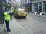 Police help draw attention to the action...