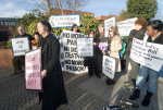 Demonstrators with placards and flowers