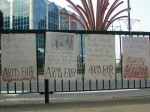 Anti Arms Trade Vigil Signs Outside of Court