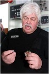 Paul Watson Holding Bullet And Bent Badge