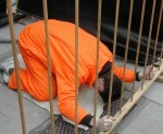 Caged prisoner