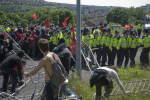 Marchers push pastthe thin line of police and clear the barriers