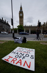 A poster lies on the floor outside Parliament.