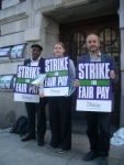 Joseph Healy (Left) supports striking workers on the picket line
