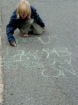 "No more climate change", chalk drawing outside Kingsnorth