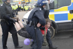 Police carry Grandmother away