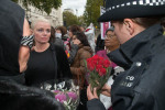 Police inspect the bouquets