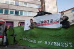 Protesters with banners outside Lunar House