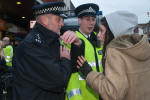 A woman argues with the inspector (who retires very shortly.)