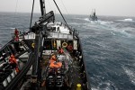 Sea Shepherd deck crew members ready a fast boat Photo by Adam Lau/Sea Shepherd