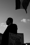 Trafalgar Square. A businessman listens to Pro-palestinian speeches. 2009