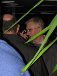 Craig Murray, flanked by university security