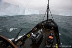 The M/V Steve Irwin navigates between two large tabletop icebergs in Antarctica