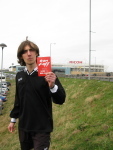A third year maths student hands out leaflets to the crowd