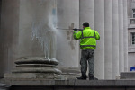 11am 2nd April - Royal Exchange, Workman removing graffiti with high pressure
